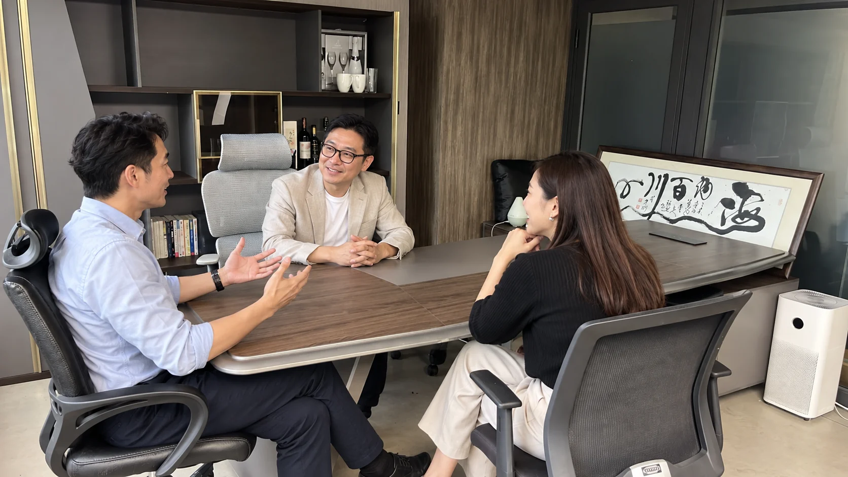 Illustrative business meeting in our Star House office; people are AI-generated